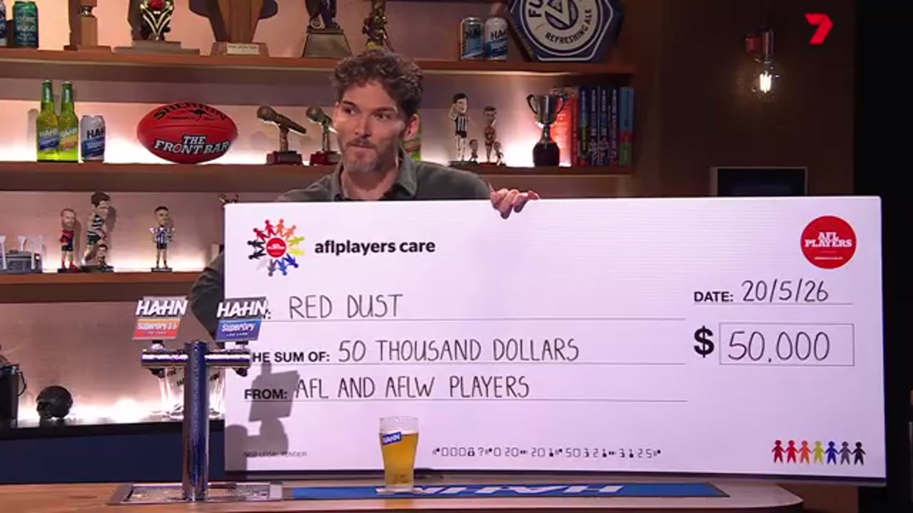 Will Minson presenting the AFL Players' Association $50,000 donation to Red Dust on The Front Bar